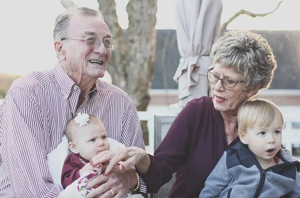 The Birches at Villa Rica - Grandparents Holding Their Grandchildren