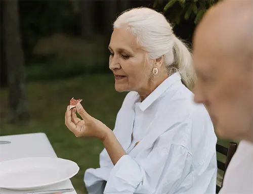 The Birches at Villa Rica - Senior Lady Eating A Fruit